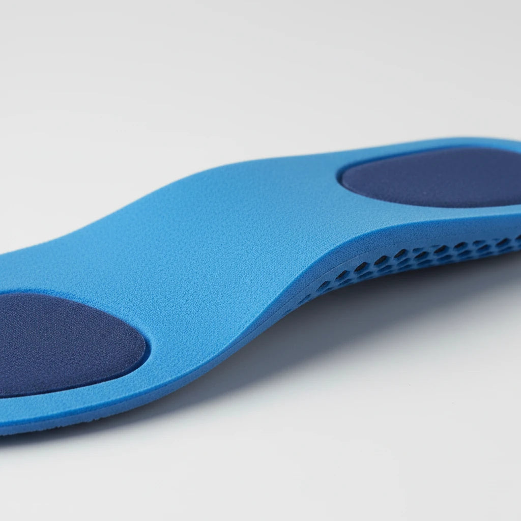 Détail coussinets bleu foncé absorption talon — ArchRelief™ | Ergosia