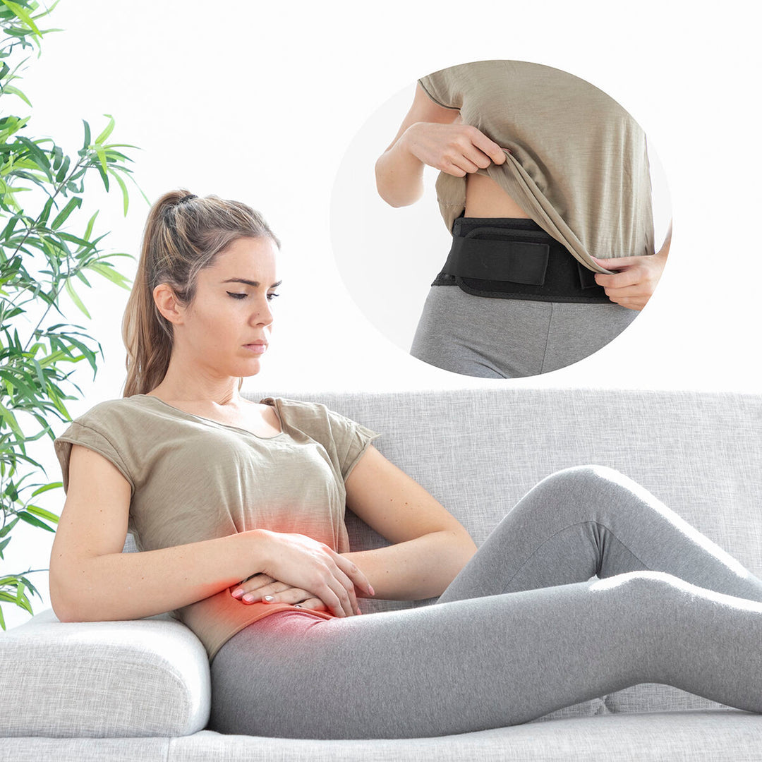 Femme utilisant la ceinture chauffante ThermoBelt sur son abdomen pour soulager les douleurs menstruelles grâce à la thermothérapie.