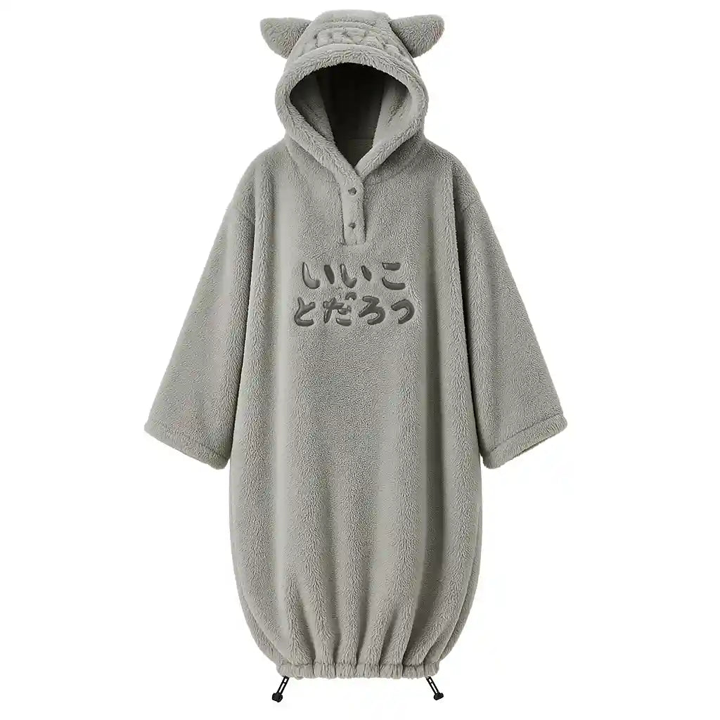 Le Cocon Polaire™ gris, sweat plaid géant ultra-doux avec capuche et cordon de serrage, pour un bien-être enveloppant à la maison.